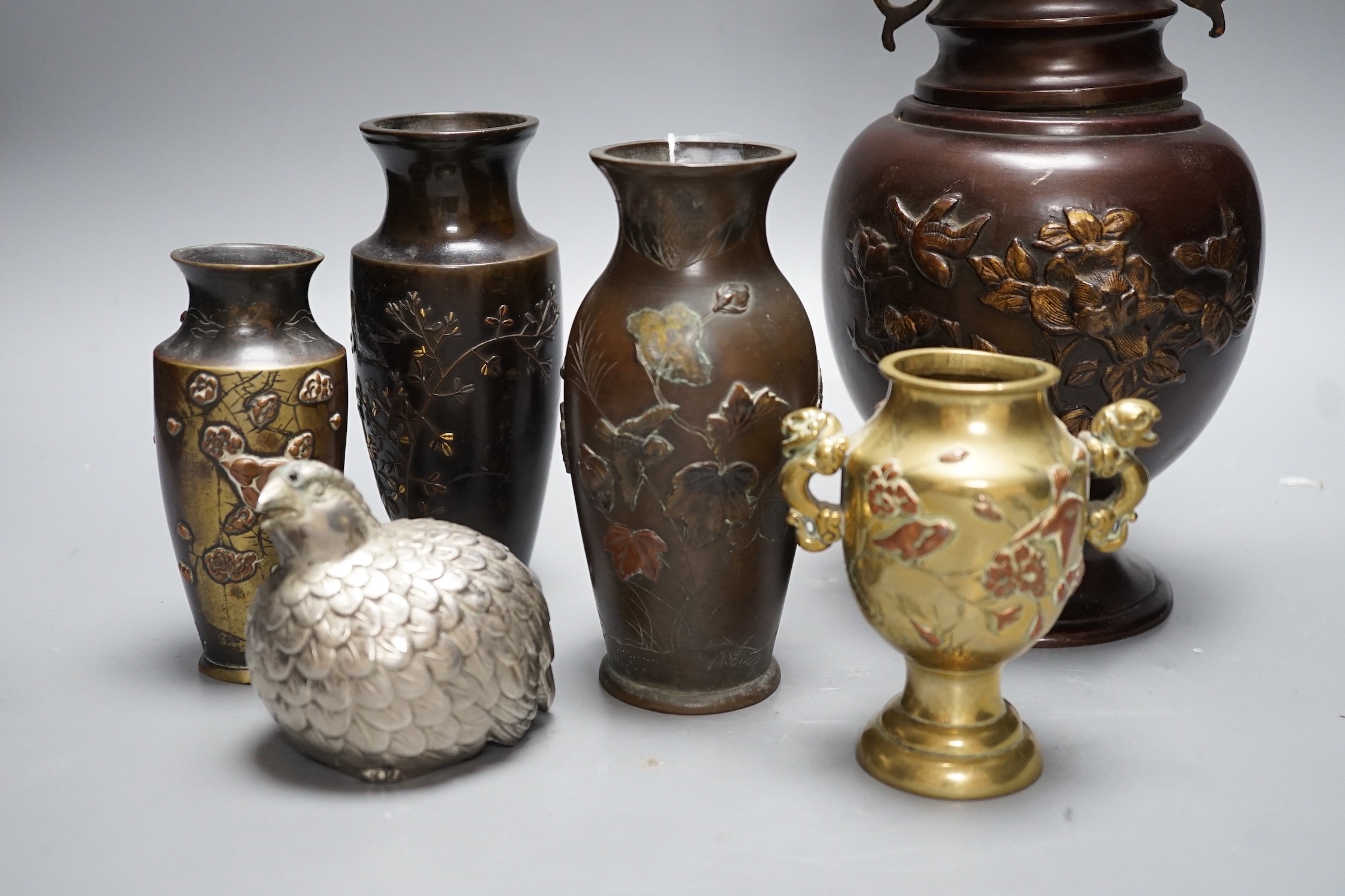 A group of Japanese bronze and mixed metal vases and a plated sugar castor, tallest 30cm